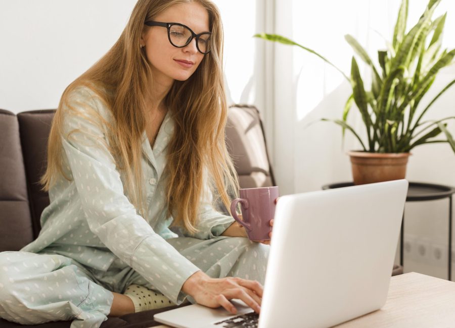 front-view-woman-pajamas-home-working